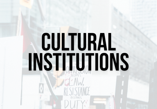Semi-transparent background of a protest for Palestine with a sign and Palestinian flags waving with bold black text: cultural institutions