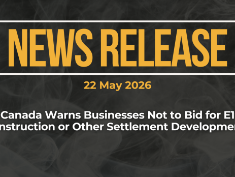 Dark background with nearly transparent white wispy smoke. Red text reads: NEWS RELEASE 22 May 2026 Canada Warns Businesses Not to Bid for E1 Construction or Other Settlement Developments